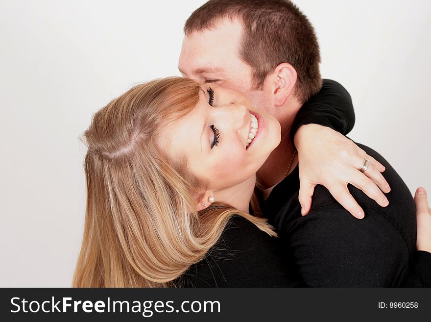 A couple playing during a photo shoot. A couple playing during a photo shoot.