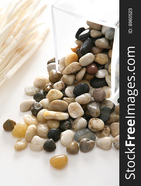 Colorful stones on white plate