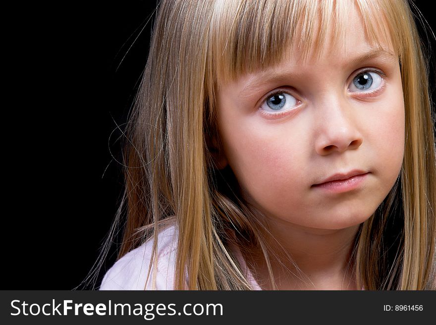 Blond Girl with big blue eyes on a black background