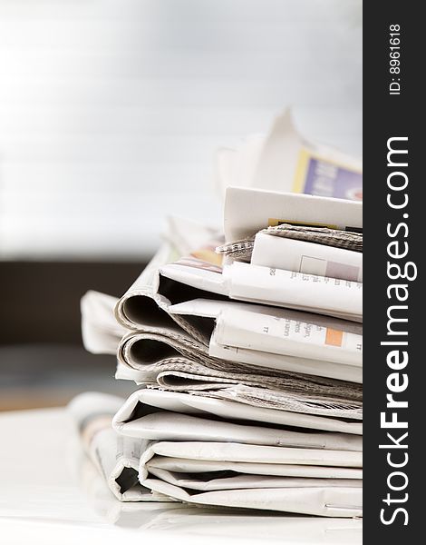 Pile of newspapers on the table