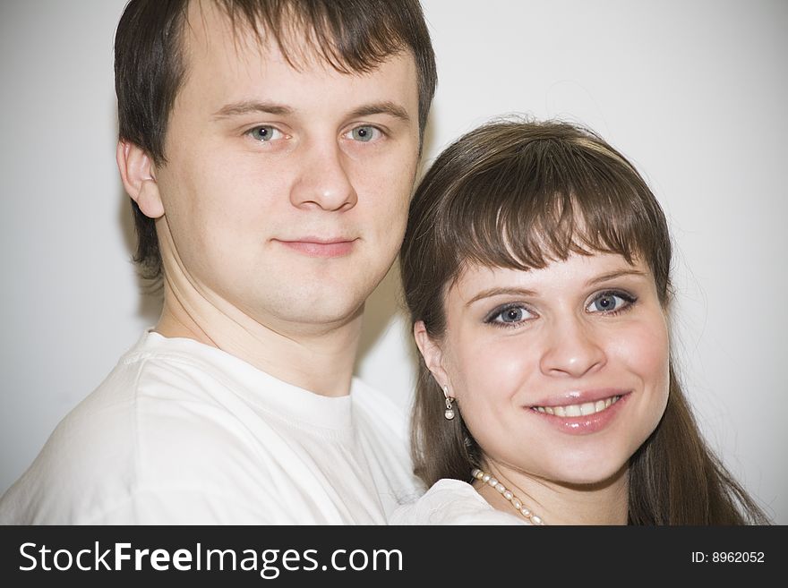 Portrait of young couple looking at camera together