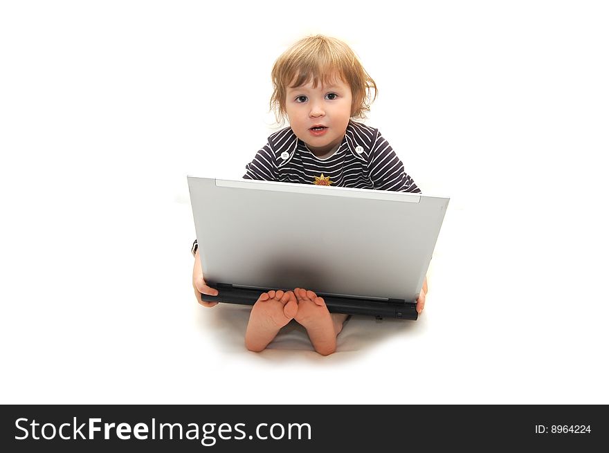 Baby girl working on laptop isolated white