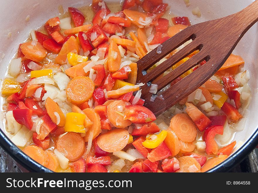 Cooking vegetables in pan for stew. Cooking vegetables in pan for stew