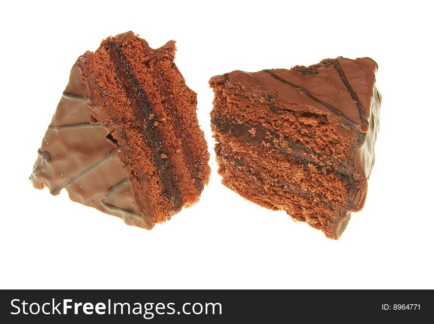 Two slices of milk chocolate gateau isolated on white. Two slices of milk chocolate gateau isolated on white