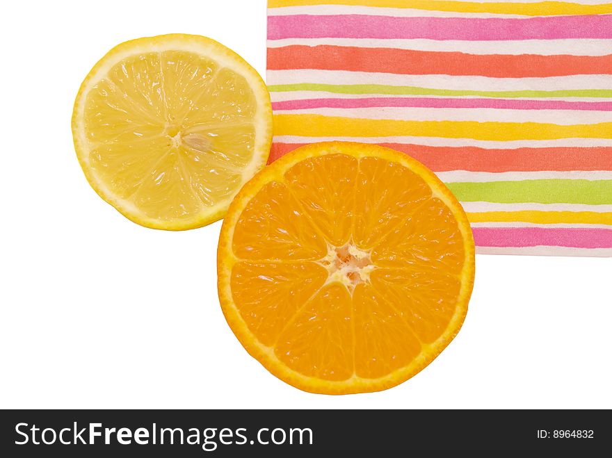 Halfs of orange and lemon on colorful background