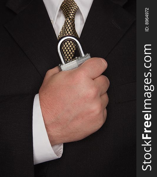 Businessman with Coat and Tie Holding Large Lock. Businessman with Coat and Tie Holding Large Lock.