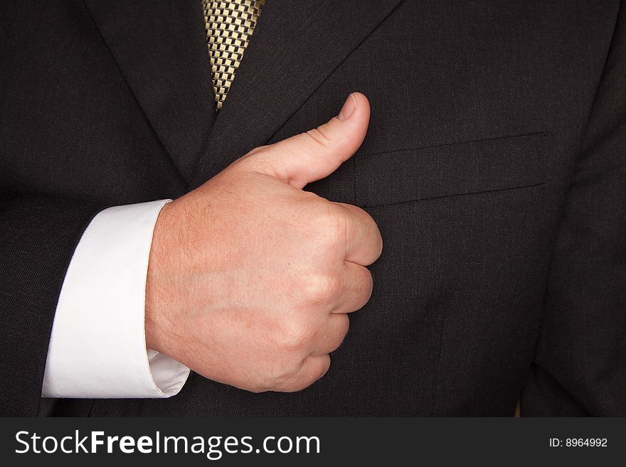 Businessman Gesturing Thumbs Up with Hand