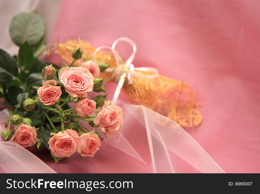 Roses to wedding bouquet, on rose background