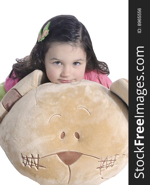 A little girl hugging a big teddy bear isolated on white background. A little girl hugging a big teddy bear isolated on white background