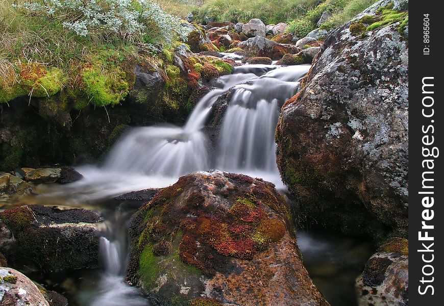 A beautiful mountain stream in autumn. A beautiful mountain stream in autumn.