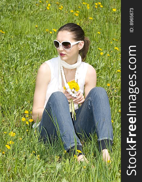 Young Woman In Nature Holding Flowers