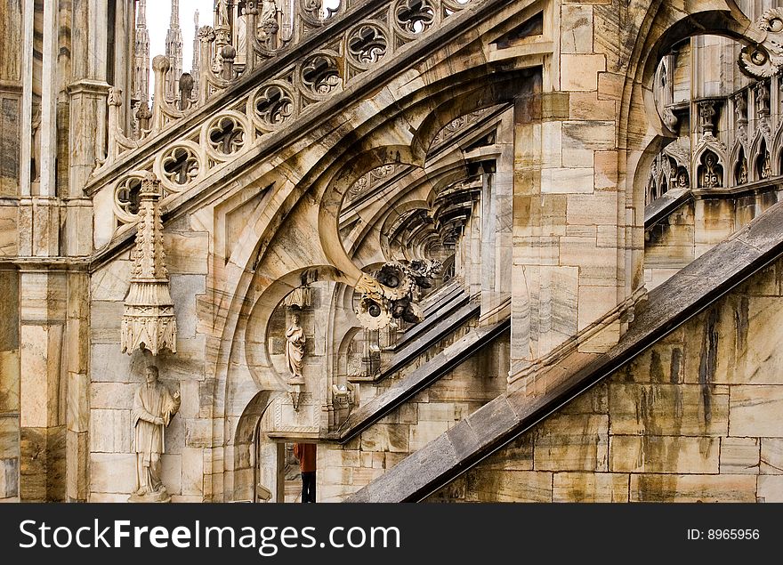 Detail of filagree stone carving on the flying butresses of the Milan Cathedral in Italy. Detail of filagree stone carving on the flying butresses of the Milan Cathedral in Italy