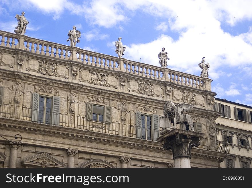 Majestic ancient town hall building in Verona Italy with statues on the roof. Majestic ancient town hall building in Verona Italy with statues on the roof