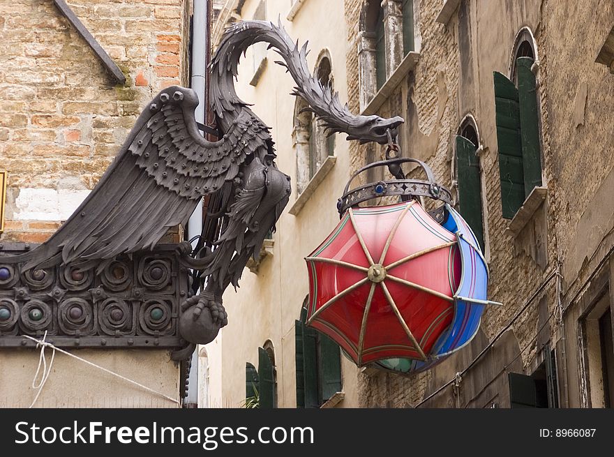 Dragon sign for umbrella shop in Venice Italy