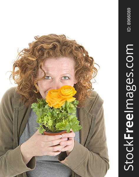 Woman holds vibrant yellow potted plant. mothers day,  spring and gardening theme. Woman holds vibrant yellow potted plant. mothers day,  spring and gardening theme