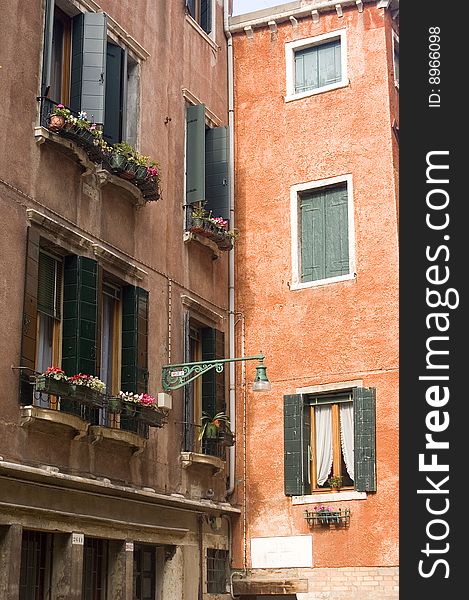 Building fronts in Venice Italy with flowers and colorful exteriors. Building fronts in Venice Italy with flowers and colorful exteriors