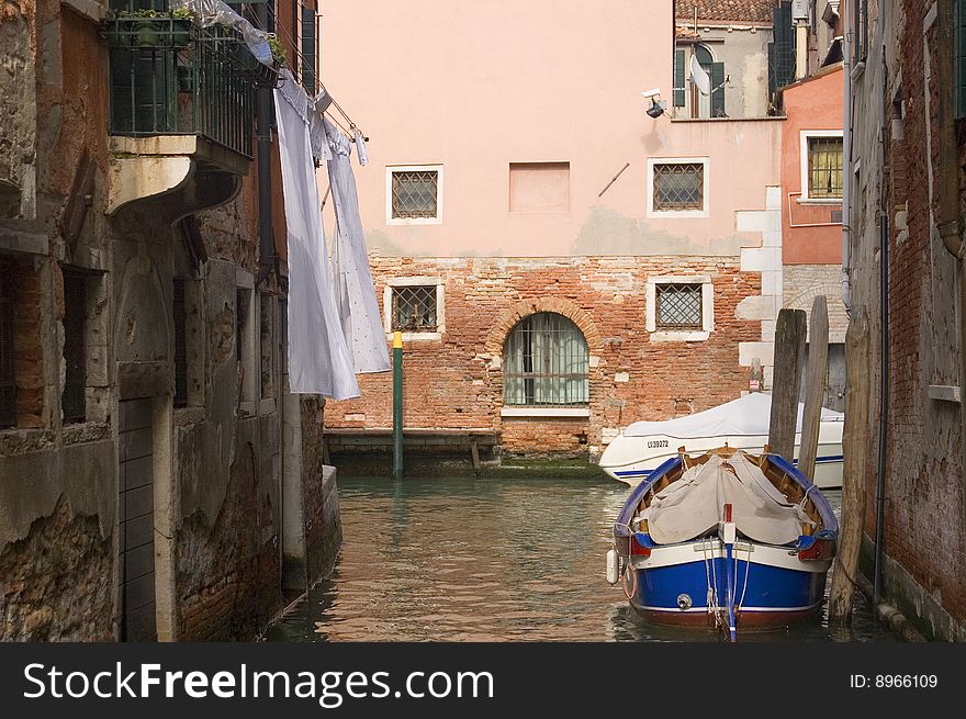 Canal in ancient Venice Italy with boats. Canal in ancient Venice Italy with boats