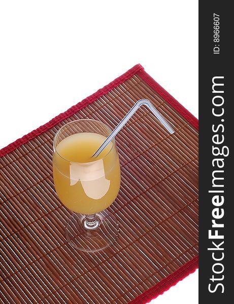 Pineapple's juice  in glass on bamboo mat