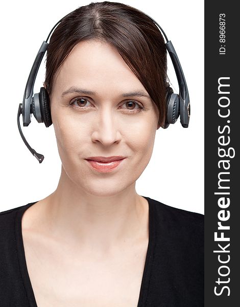 A woman with a headset communications gear on white. A woman with a headset communications gear on white.