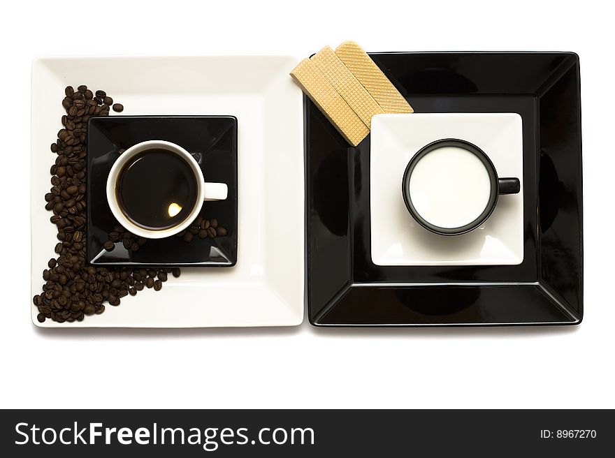 A lovely set of a coffee mug and coffee beads, isolated on a white background, viewed from above.