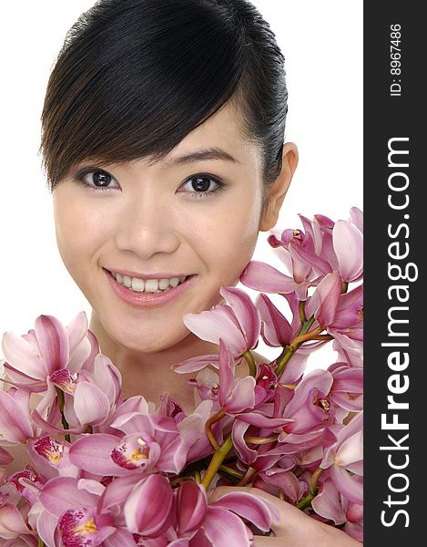 Portrait of woman with pink orchids. Portrait of woman with pink orchids