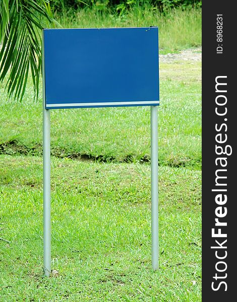 Blue advertise on green natural background. blank image