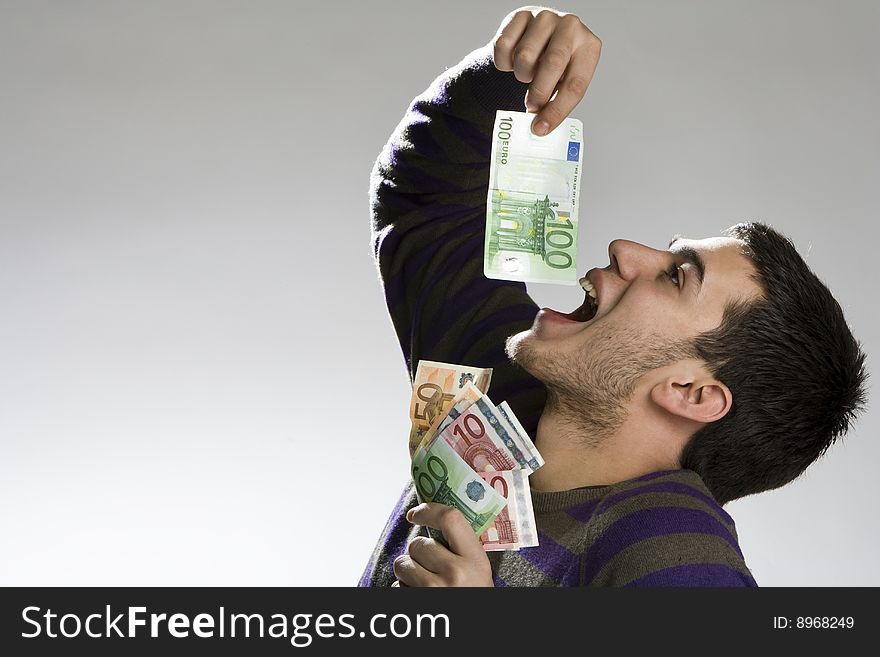 Happy businessman with bundle of euro money, good business!