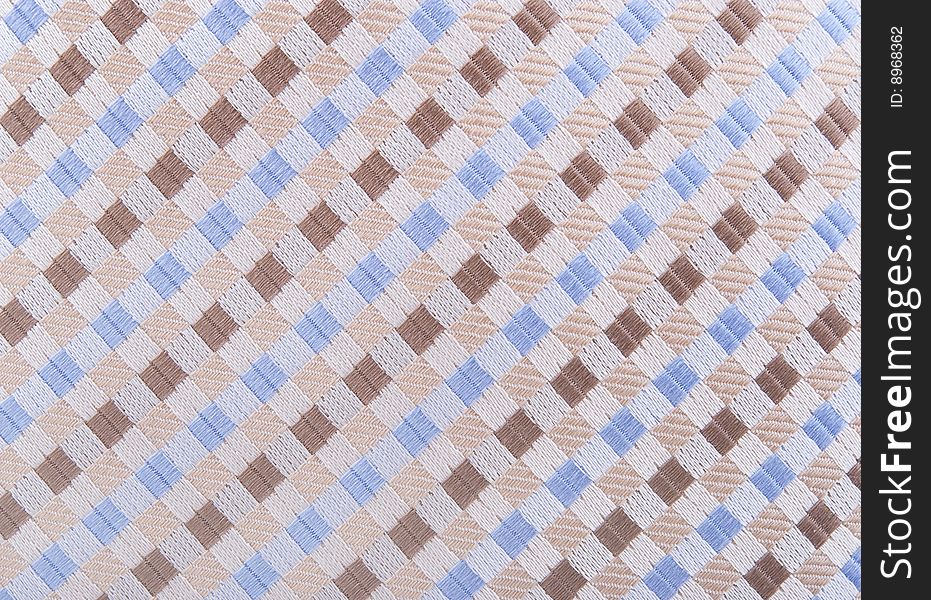 Textile background with blue, brown and beige shapes