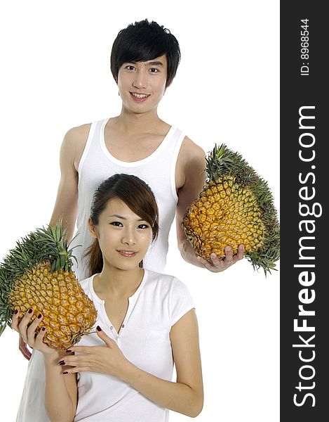 Young love couple with pineapple. Young love couple with pineapple