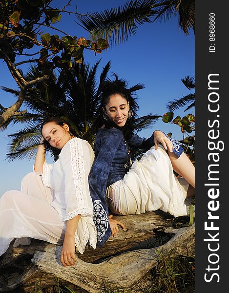 Portrait of two fashion female models on tropical beach. Portrait of two fashion female models on tropical beach