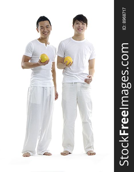 Asian young man holding grapefruit. Asian young man holding grapefruit