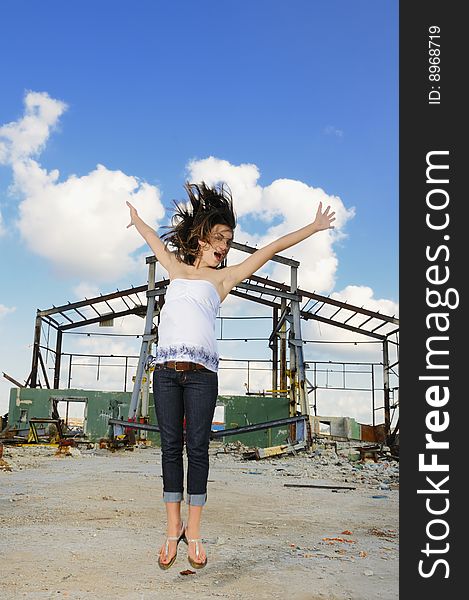 Portrait of young fashion female jumping of joy. Portrait of young fashion female jumping of joy