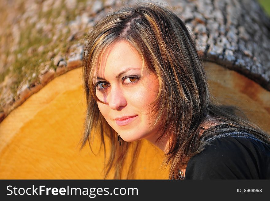 Outdoor portrait of a brunette woman with big brown eyes. Outdoor portrait of a brunette woman with big brown eyes