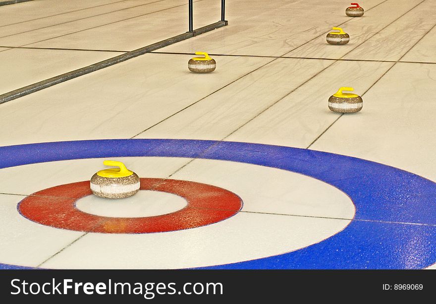 This curling rock is right in the house and well guarded in this game.