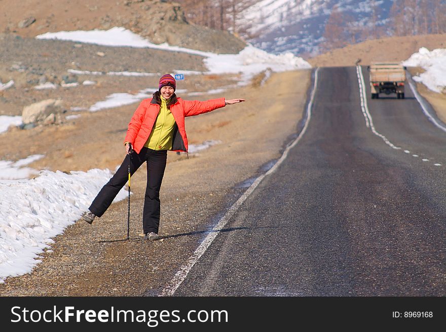 Young woman on the roadside