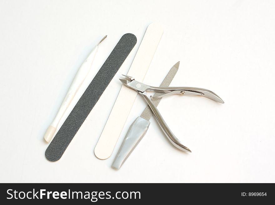 A collection of manicure tools often used by women. A collection of manicure tools often used by women