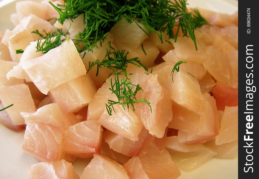 Tilapia cubed and waiting to join the chowder. Fresh dill is keeping it company.