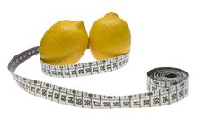 Two Lemons And A Measuring Tape Royalty Free Stock Photography Two Lemons And A Measuring Tape Royalty Free Stock Photography