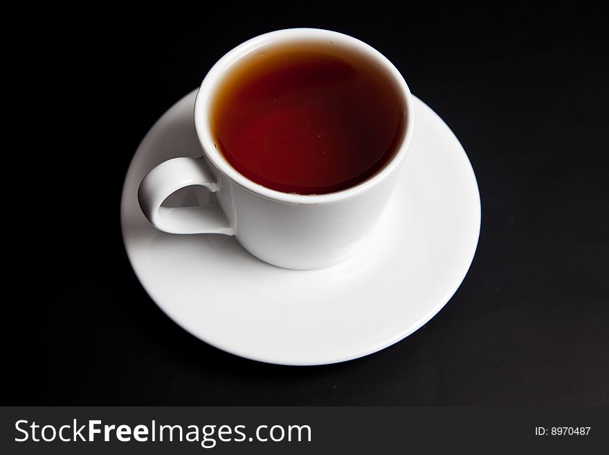 Cup of tea on a black background