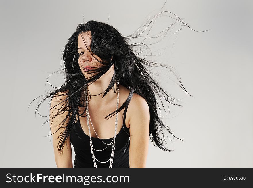 Portrait of hispanic Brunette beauty with long hair flowing