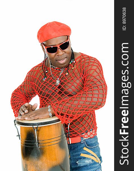 Young handsome cuban man plays on percussion. Young handsome cuban man plays on percussion