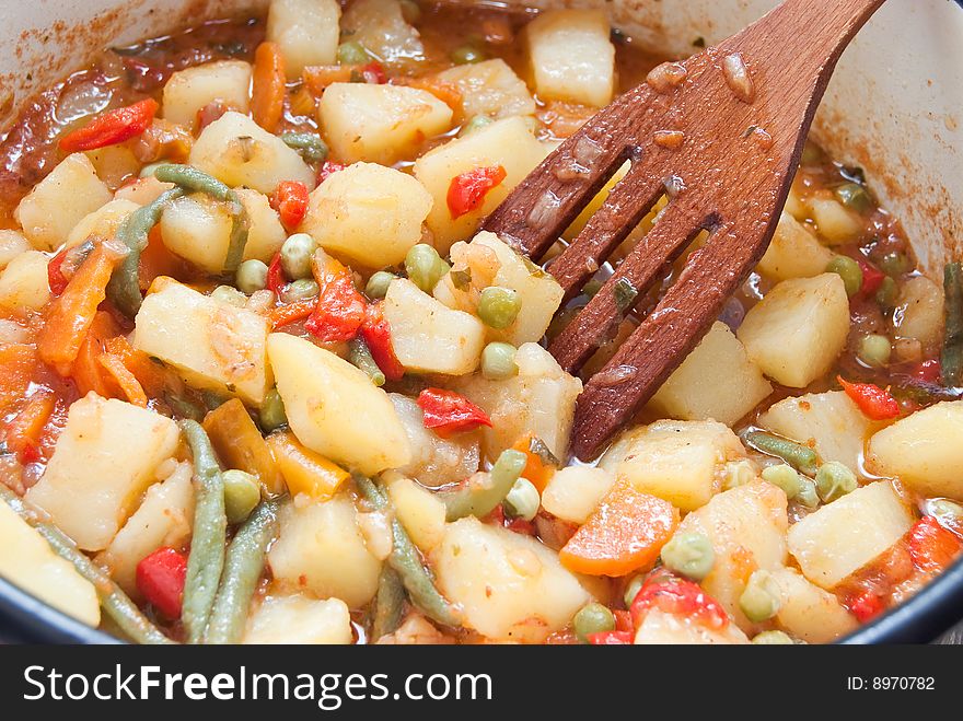 Cooking vegetables in pan for stew. Cooking vegetables in pan for stew