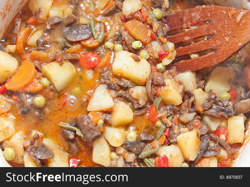 Cooking vegetables in pan for stew. Cooking vegetables in pan for stew