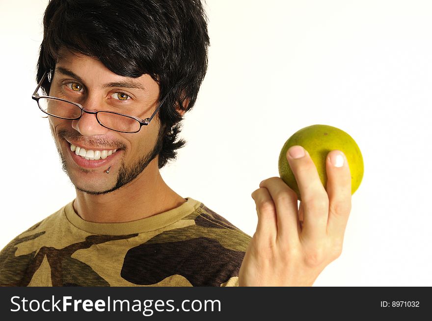 Portrait of healthy young man holding orange fruit and smiling - isolated