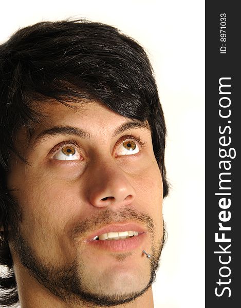 Portrait of a young hispanic man looking up - isolated over white background