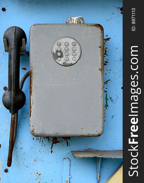 It is a old public phone. It is a old public phone