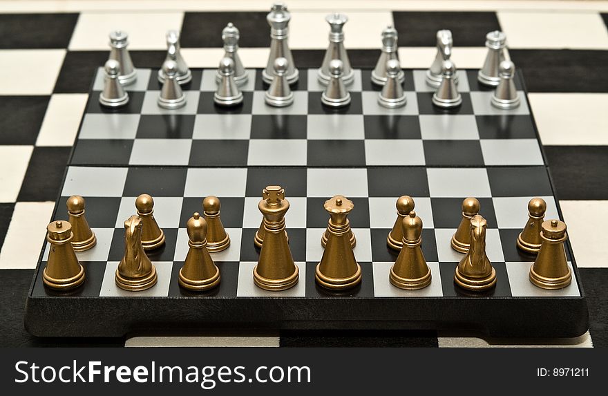 Gold and silver chess on a white background. Gold and silver chess on a white background