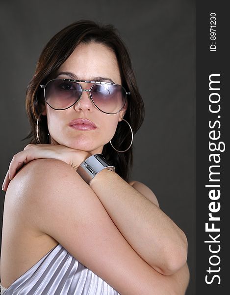 Portrait of young fashion woman wearing sunglasses. Portrait of young fashion woman wearing sunglasses