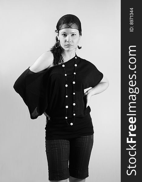 Black and white portrait of young trendy fashion woman posing. Black and white portrait of young trendy fashion woman posing