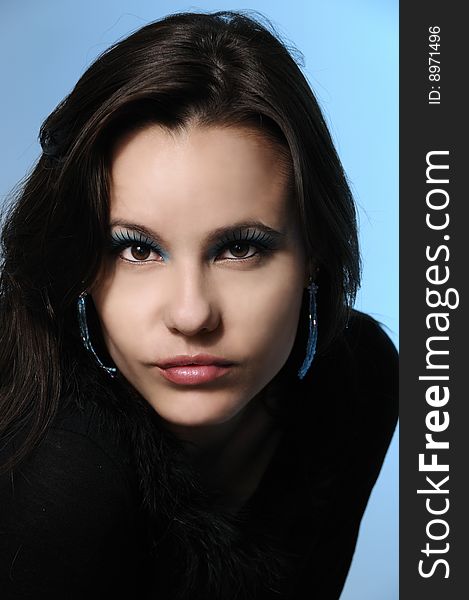 Portrait of young fashion woman with make up and straight look